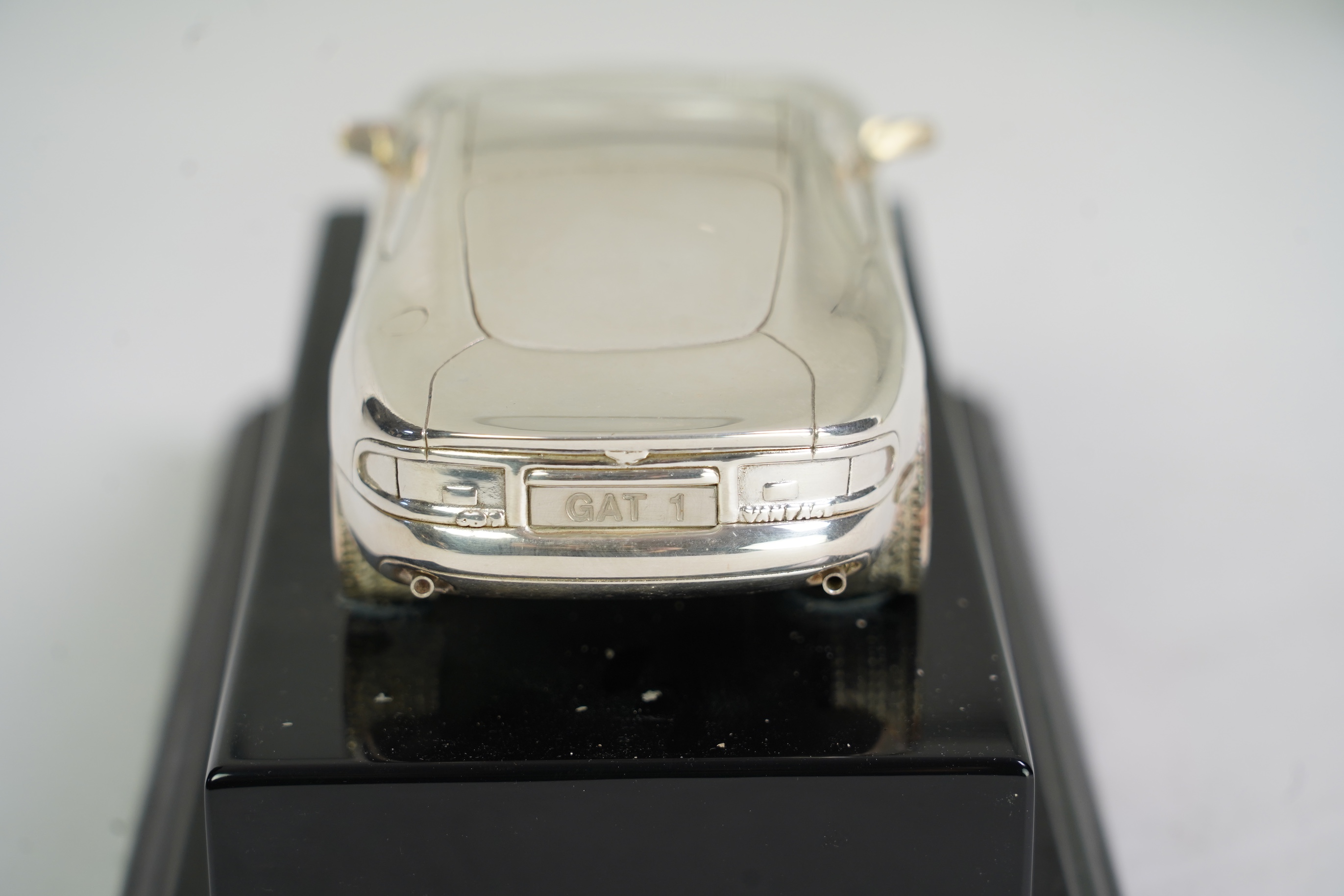 An Elizabeth II miniature silver model of an Aston Martin DB7 Vantage, by Aston Martin Lagonda Design Ltd